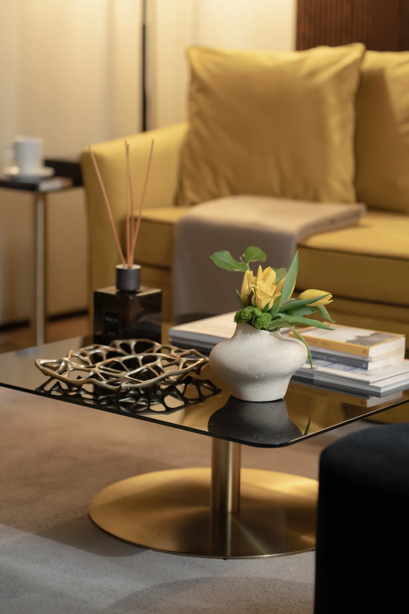 Suite detail — Culti Milano, brass, coffee table books