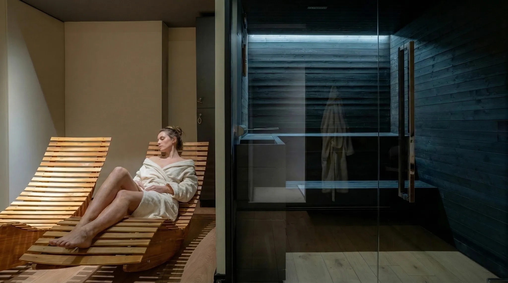 The wellness floor — sauna, oak, muted light