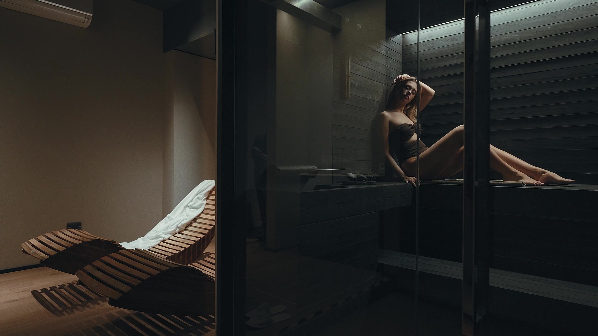 The wellness floor — Finnish sauna, oak loungers, quiet light