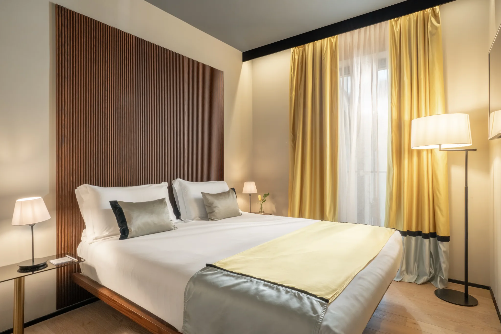 Junior Suite — bedroom detail, warm textures